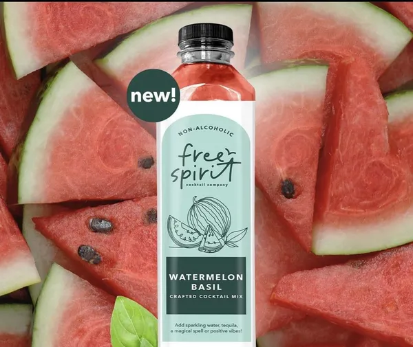 Watermelon Basil bottle on a bed of its fresh ingredients